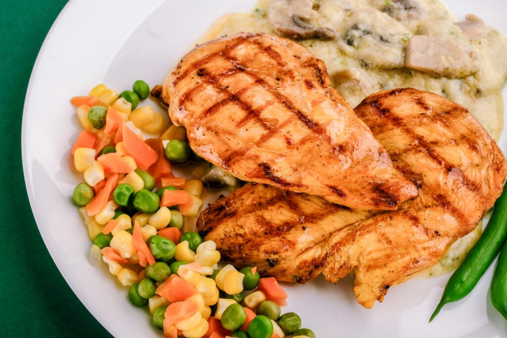 grilled chicken and rice on a plate