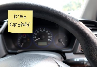 Car,Console,Panel,With,Handwritten,Stick,Note,Drive,Carefully,,