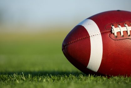 football resting on turf