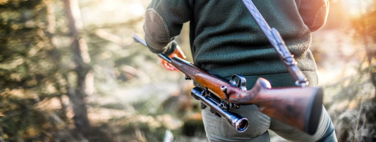 Hunter carrying a rifle