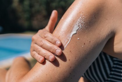 women applying sunscreen