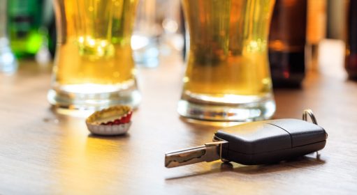 Drinking,And,Driving,Concept.,Car,Key,On,A,Wooden,Table,